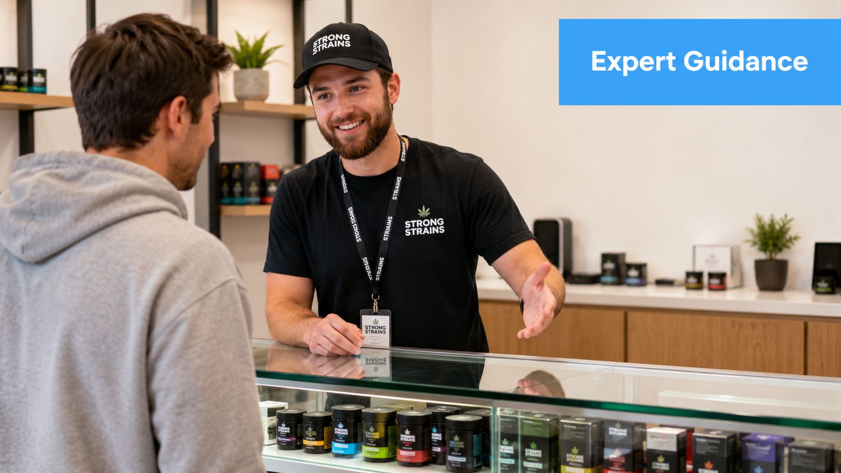 A friendly staff member at a dispensary counter offering expert guidance to a customer.